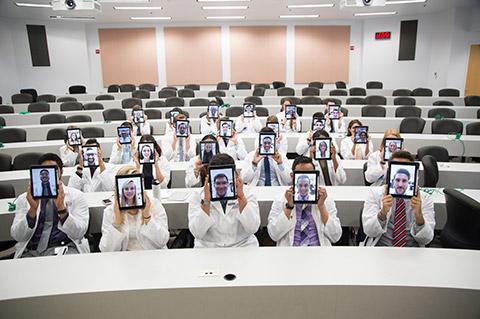 FAU medical students in class holding their iPads